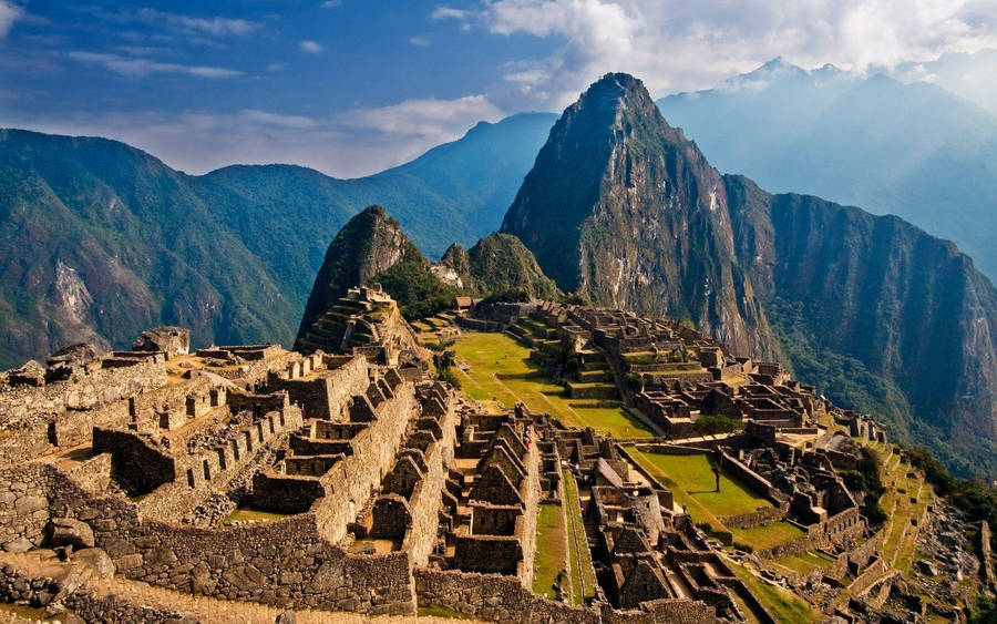 Mystical Sunrise Over The Iconic Machu Picchu, Peru Wallpaper