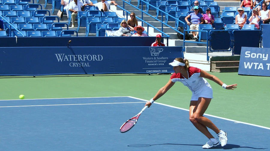 Nadia Petrova Fervently Chasing The Tennis Ball Wallpaper