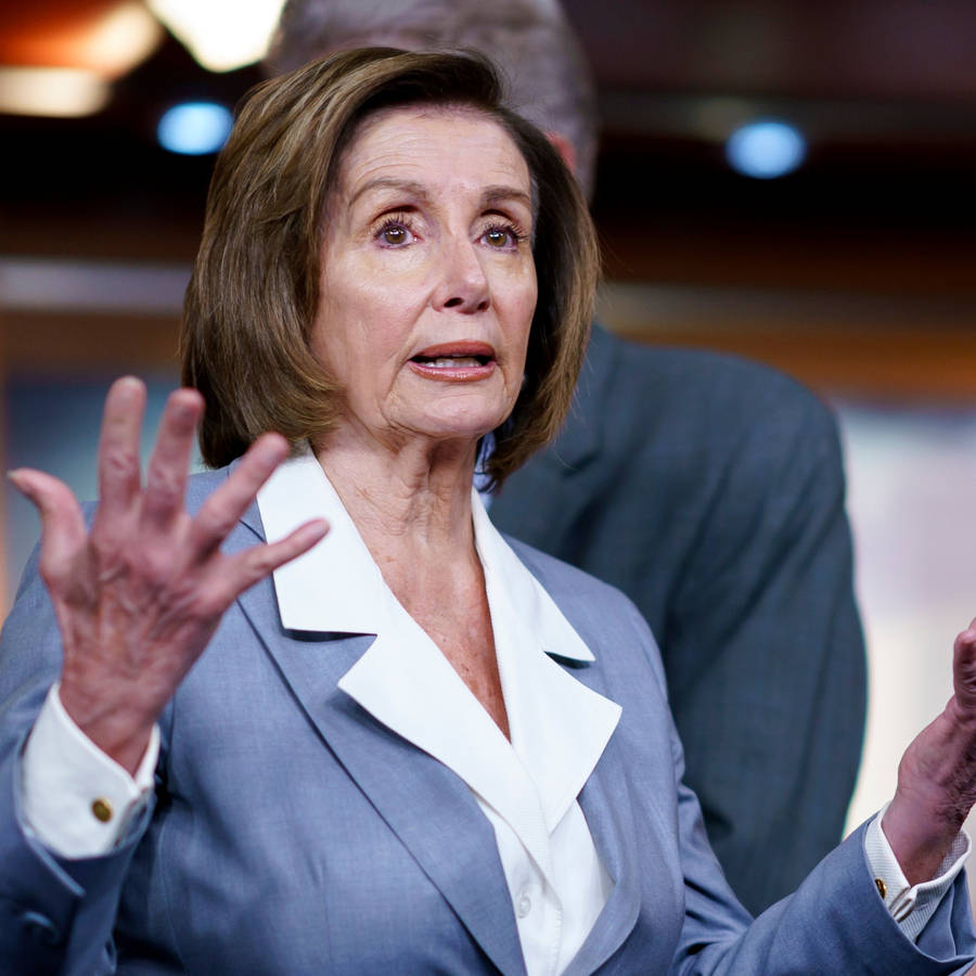 Nancy Pelosi In Blue Clothing Wallpaper