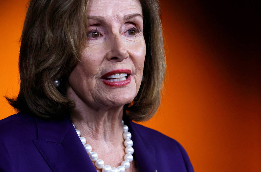 Nancy Pelosi Orange Black Background Wallpaper