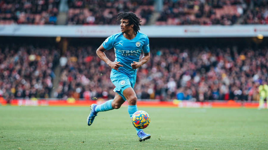 Nathan Ake Running Full Body Wallpaper