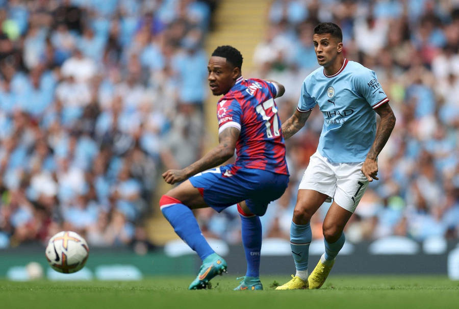 Nathaniel Clyne With Opponent In Blue Wallpaper