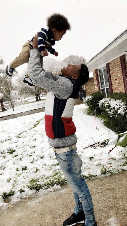 Nba Youngboy With Kid In Winter Wallpaper