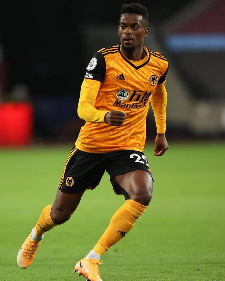 Nelson Semedo Wearing Yellow And Black Wallpaper