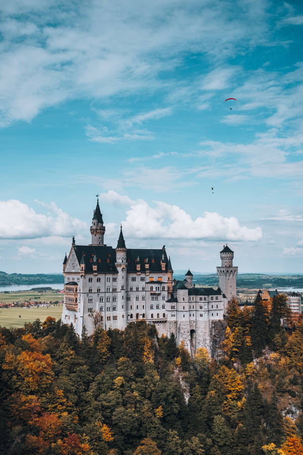 Neuschwanstein Castle Orange And Green Leaves Wallpaper