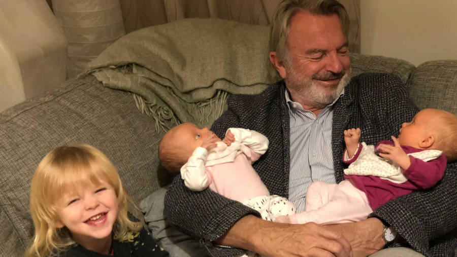 New Zealand Actor Sam Neill With Grandkids Wallpaper