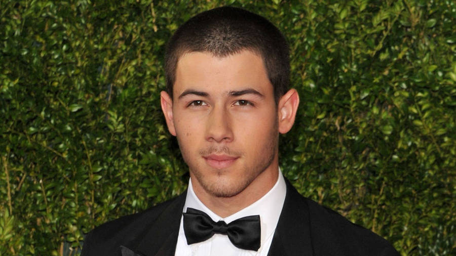 Nick Jonas In Black Tuxedo Wallpaper