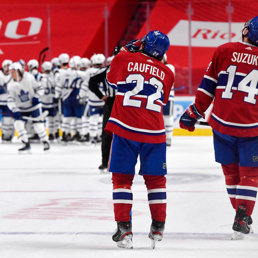 Nick Suzuki And Cole Caufield Against Toronto Maple Leafs Wallpaper