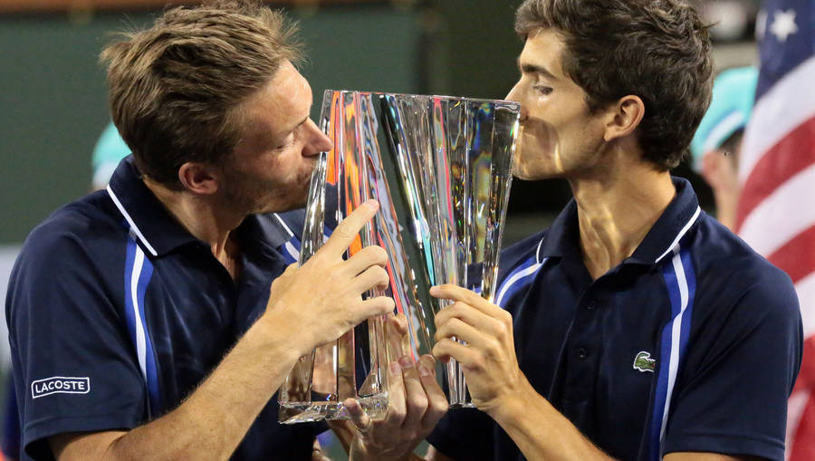 Nicolas Mahut And Herbert Kissing Trophy Wallpaper