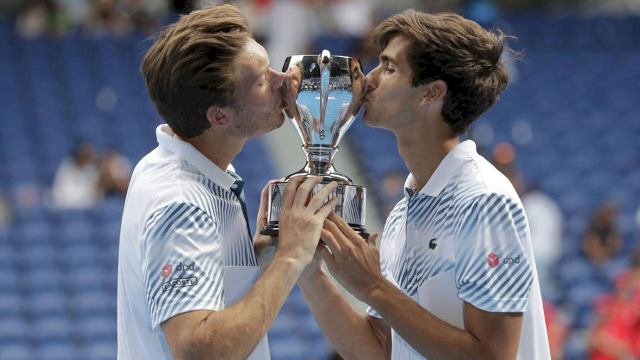 Nicolas Mahut And Partner Kissing Trophy Wallpaper