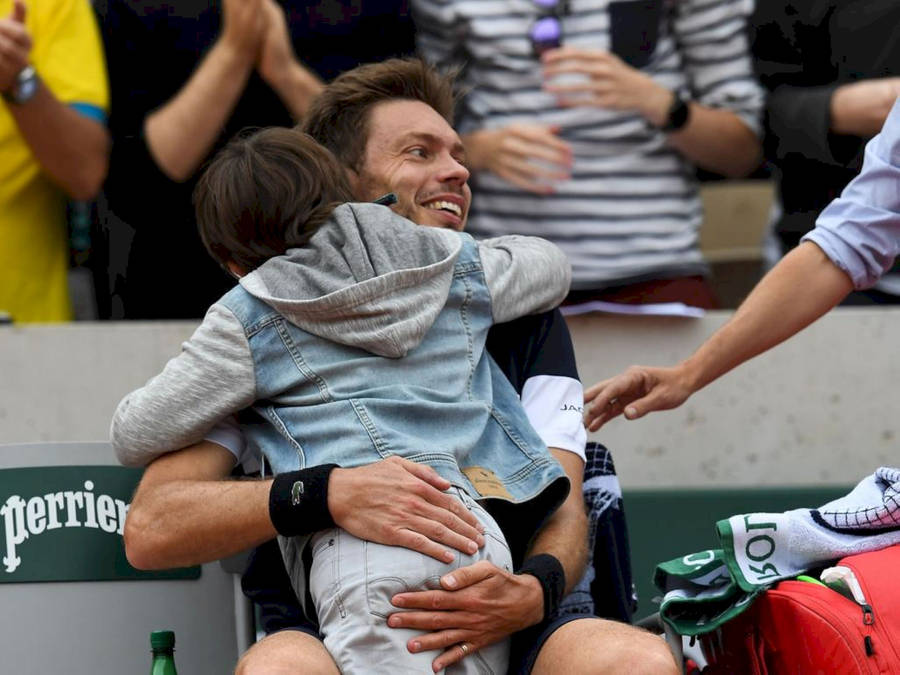 Nicolas Mahut Hugging His Child Wallpaper