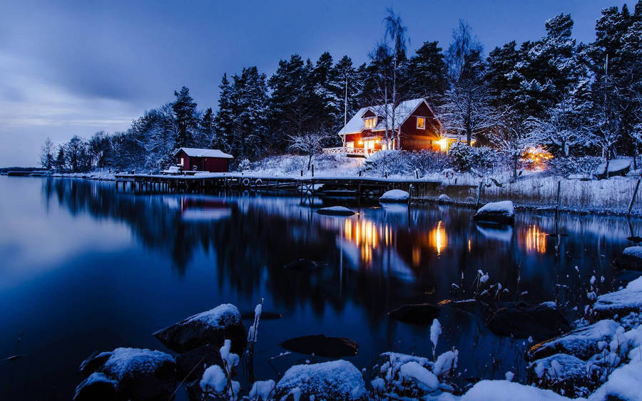 Night Cabin Winter Scenery In Sweden Wallpaper