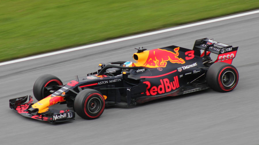 Night Thrill - Red Bull Racing Car In Action Wallpaper