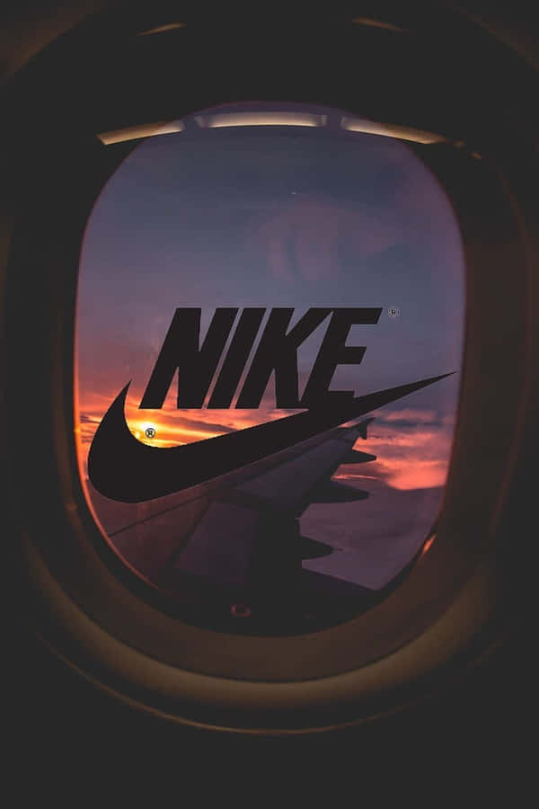 Nike Logo In The Window Of An Airplane Wallpaper
