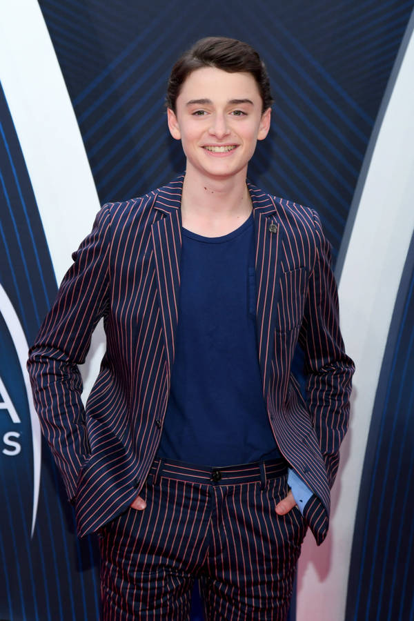 Noah Schnapp Wearing Striped Suit Wallpaper