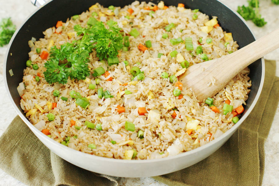 Non-stick Wok Filled With Egg Fried Rice Wallpaper