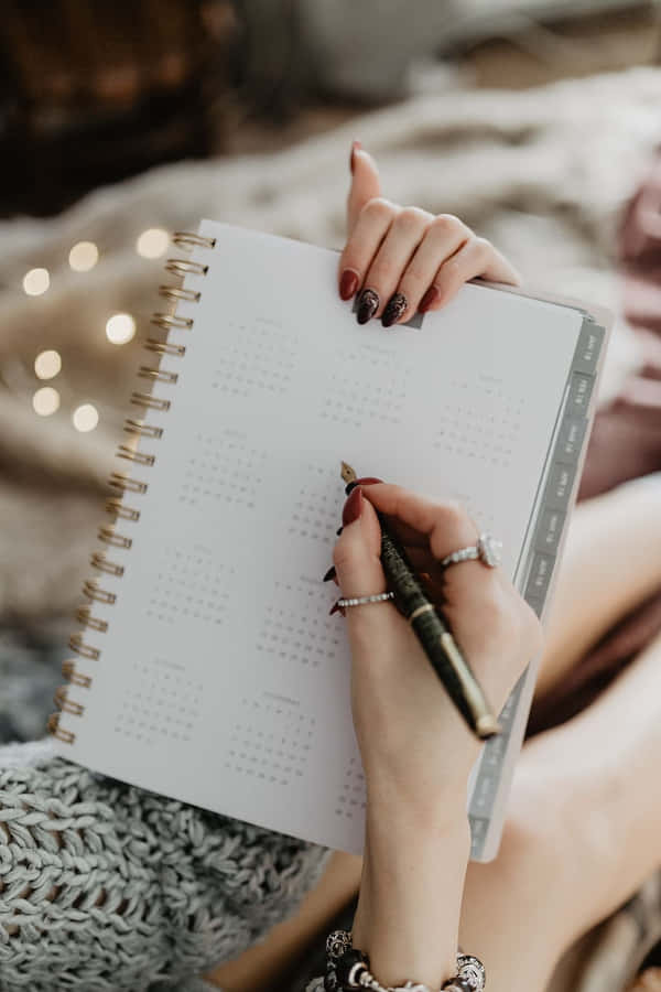 Notebook Writing Using Black Pen Wallpaper