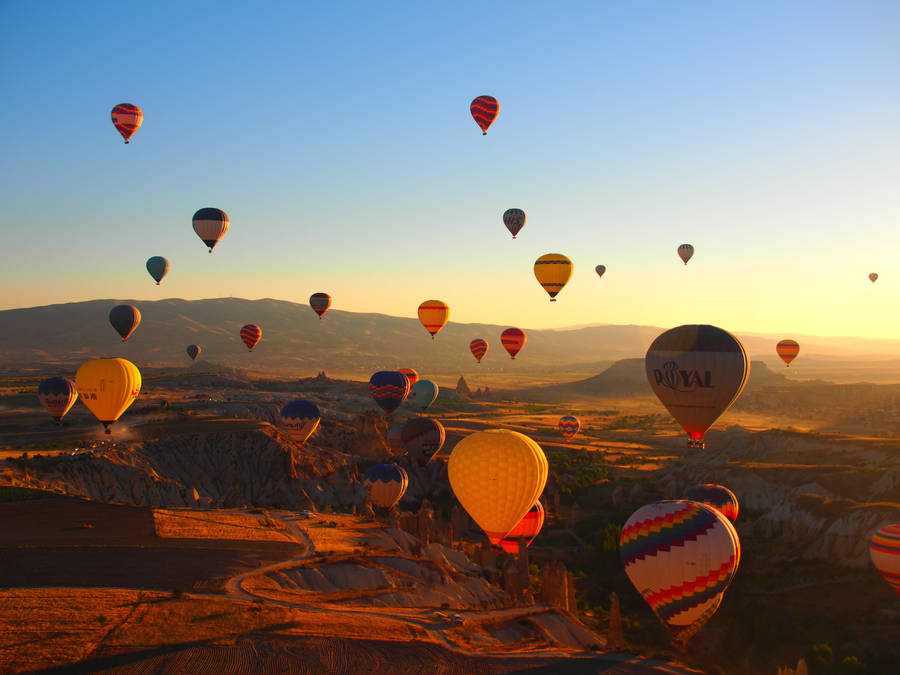 Numerous Hot Air Balloons Floating Sunset Wallpaper