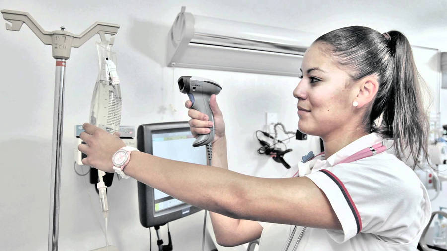 Nurse Fixing A Dextrose Bag Wallpaper