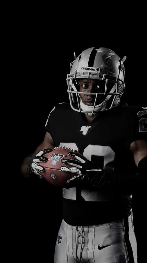 Oakland Raiders Holding Ball Wallpaper