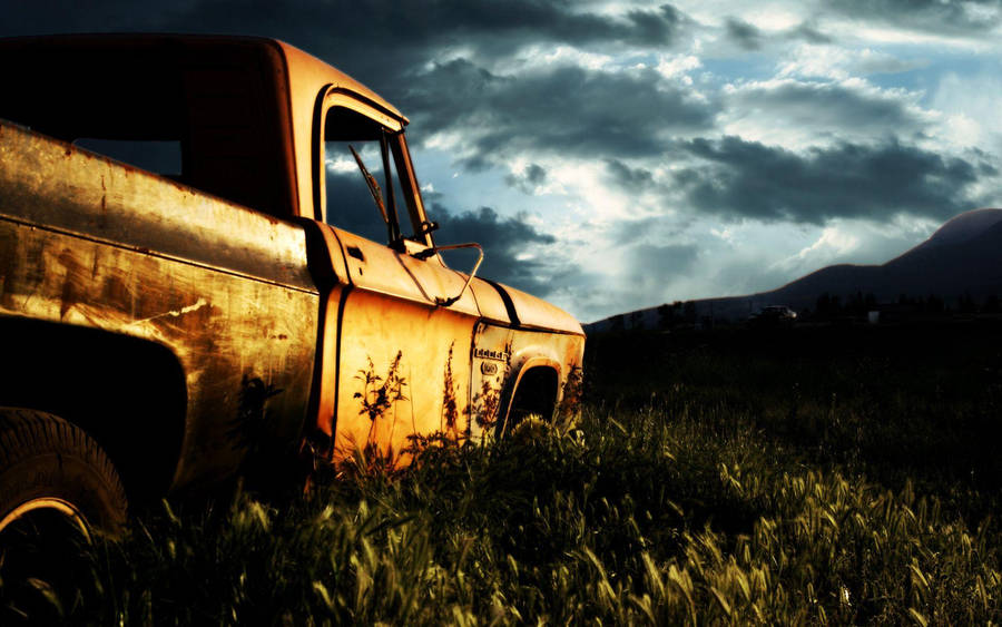 Old Car In Field Wallpaper