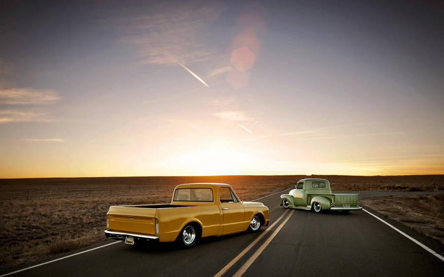 Old Ford Trucks During Sunset Wallpaper