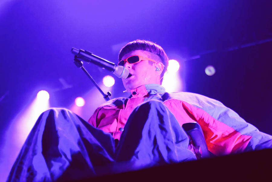 Oliver Tree Performing On Stage Wallpaper