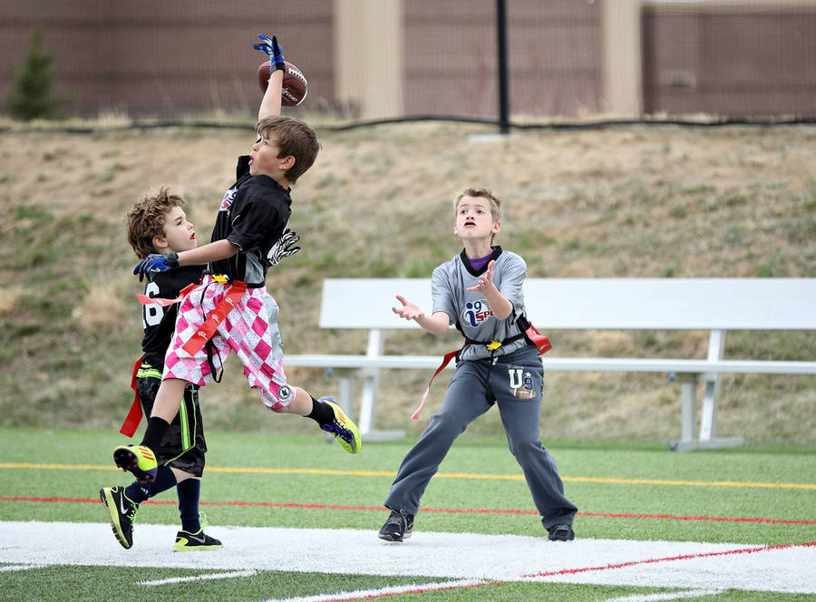 One-handed Catch Flag Football Wallpaper