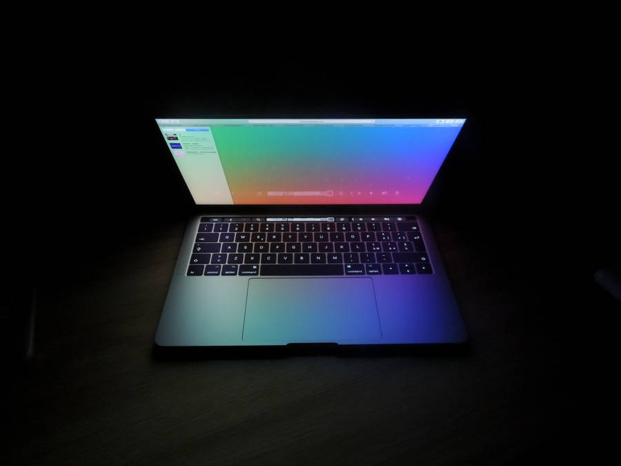 Open Laptop Captured On Dark Screen Wallpaper