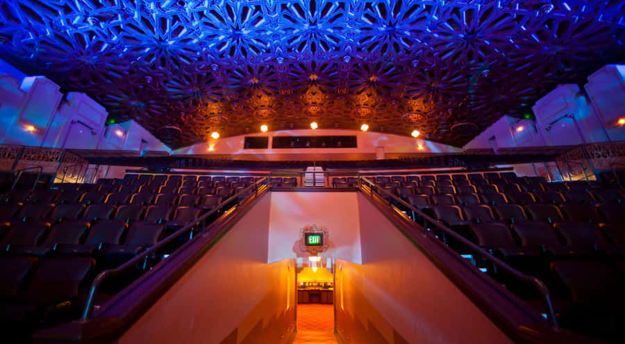 Ornate Cinema Hall Interior Wallpaper