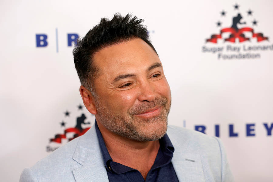 Oscar De La Hoya Happy In White Suit Wallpaper