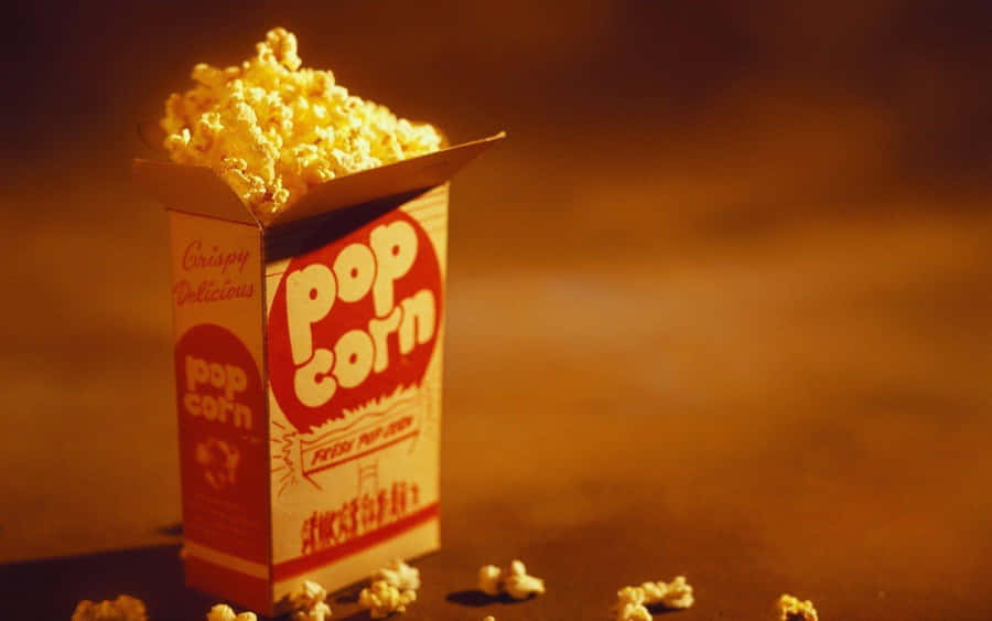 Overflowing Popcorn Box Cinema Snack Wallpaper