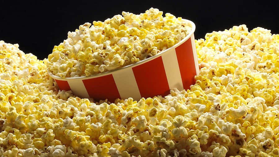 Overflowing Popcorn Bucket Delight Wallpaper