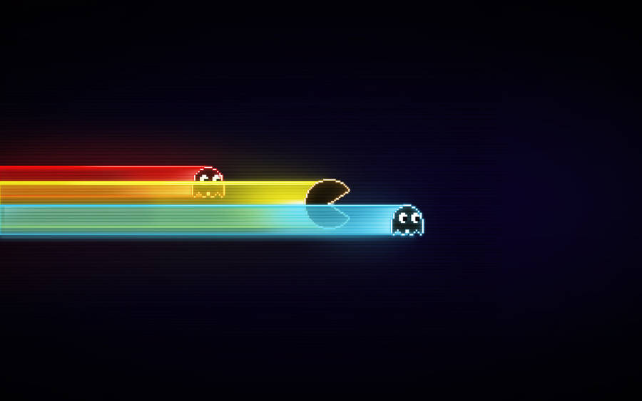 Pac Man Racing Against Ghosts Wallpaper