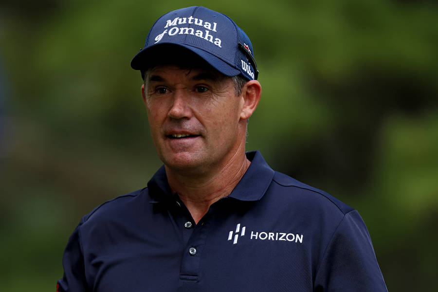 Padraig Harrington, Golf Professional In A Blue Cap And Uniform Wallpaper