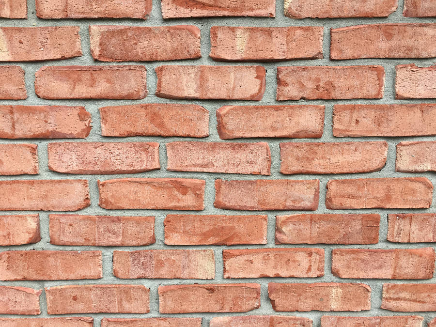 Pale Red Brick Texture With Spaces Wallpaper