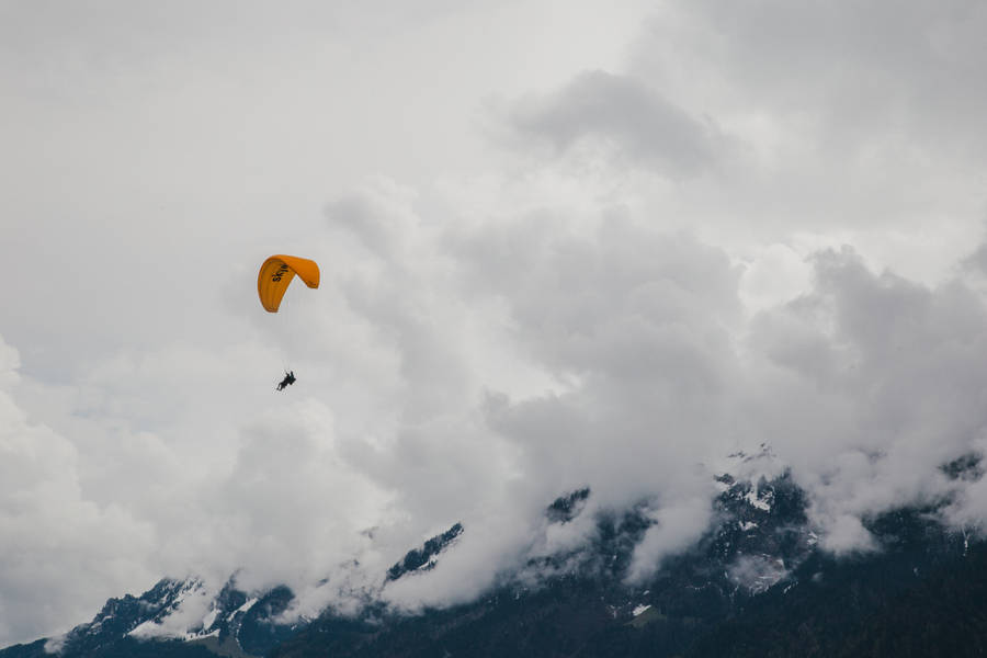 Paragliding Over Swiss Alps Wallpaper
