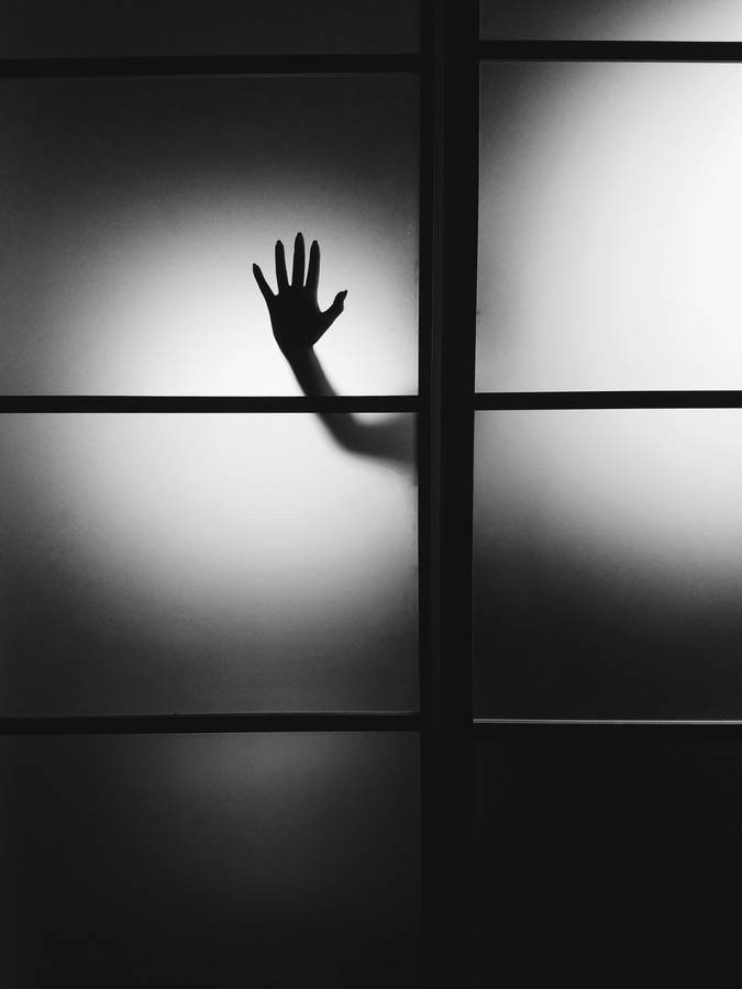 Paranormal Hand On Glass Wall Wallpaper
