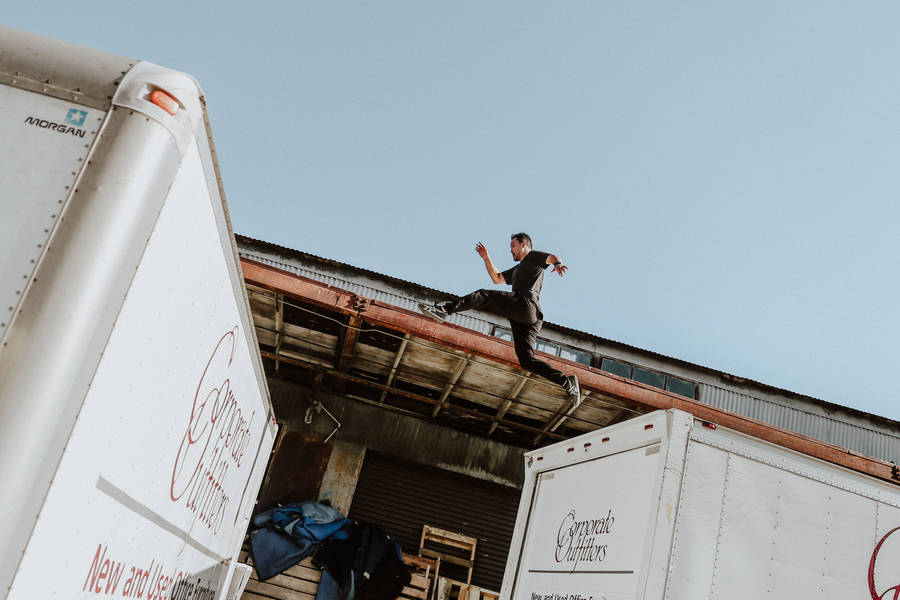 Parkour Above Trucks Wallpaper