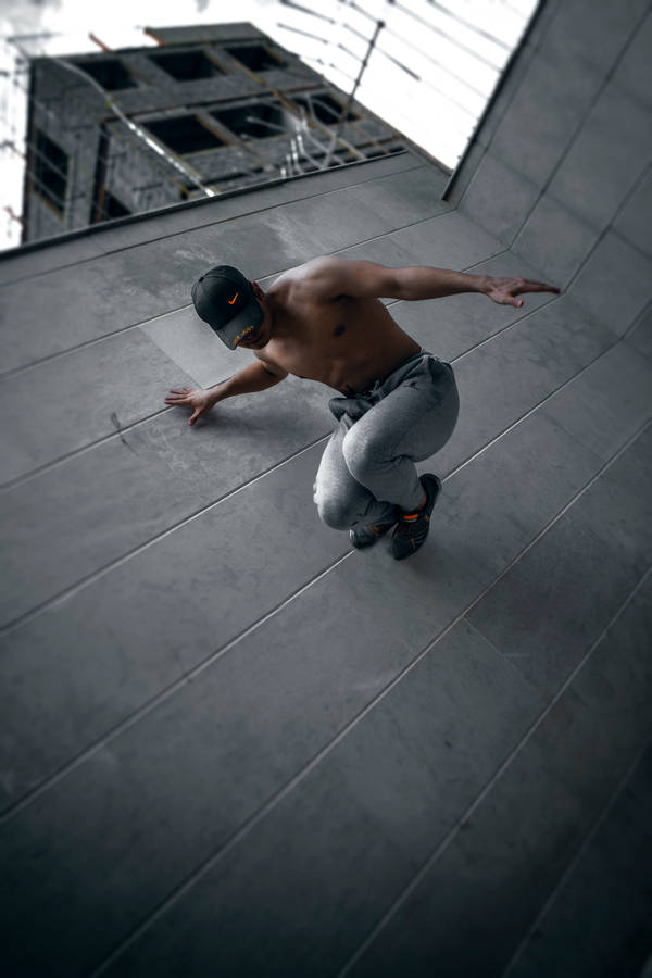 Parkour Man On Concrete Wall Wallpaper