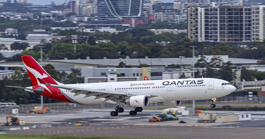 Passenger Aircraft Of Qantas On A Take Off Wallpaper