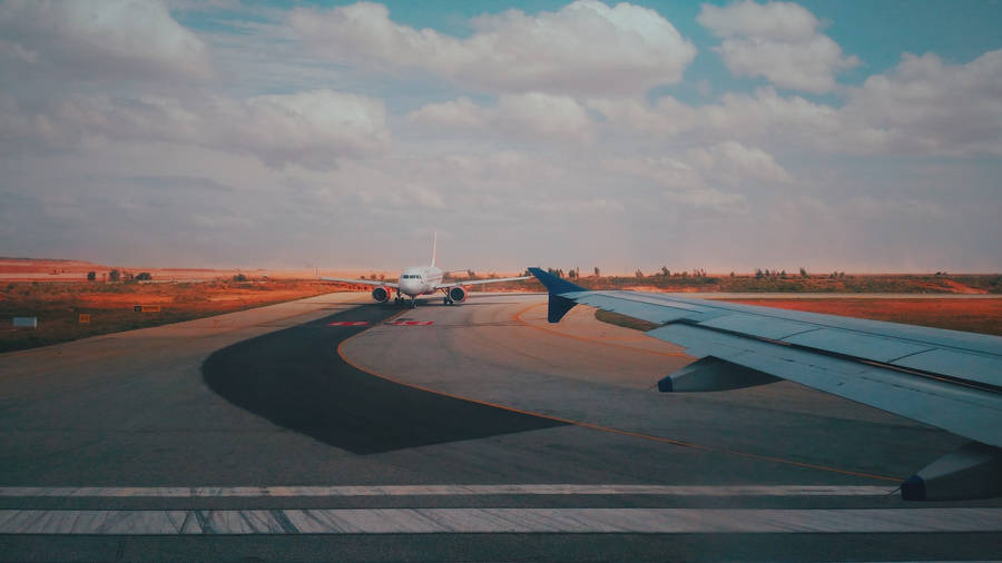 Passenger Plane On Runway Wallpaper