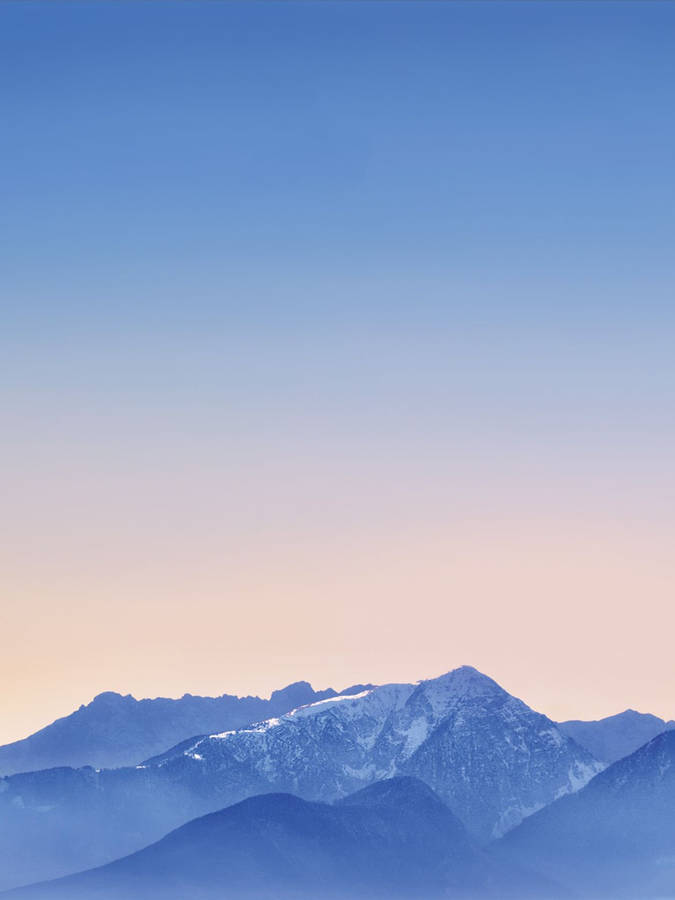 Pastel Horizon Over Mountains Ipad Wallpaper