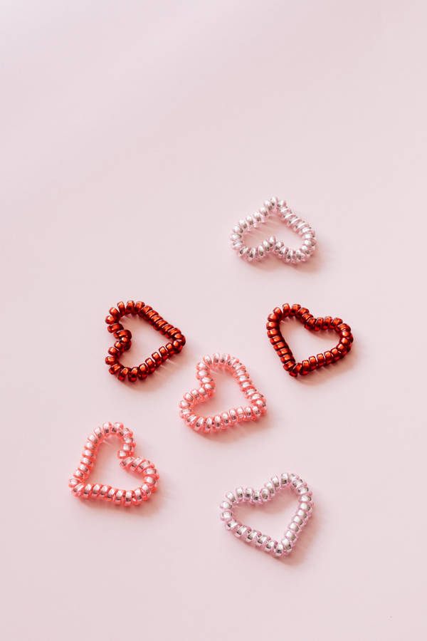 Pastel Pink Heart Spiral Hair Ties Wallpaper