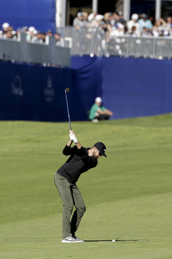 Patrick Rodgers In Mid-swing On Golf Course Wallpaper