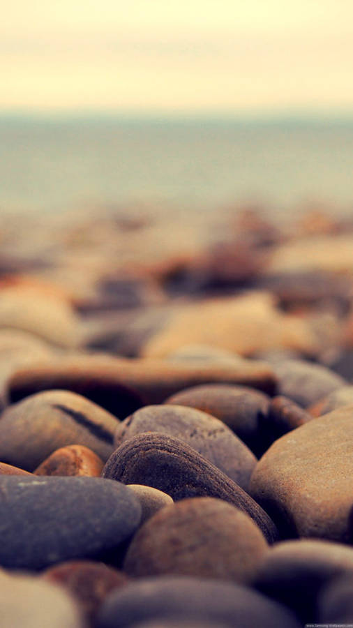 Pebbles On Beach Iphone Wallpaper