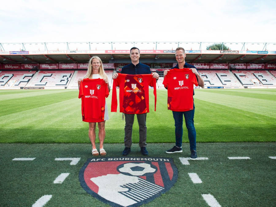 People Holding Afc Bournemouth Jerseys Wallpaper