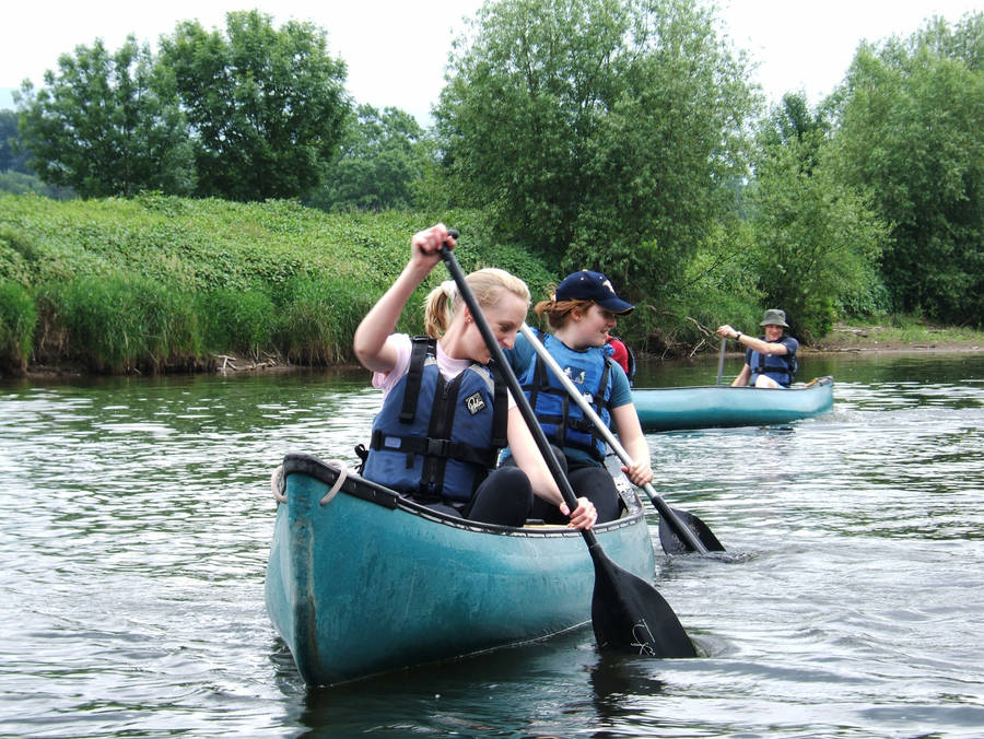 People In Canoeing Boat Wallpaper