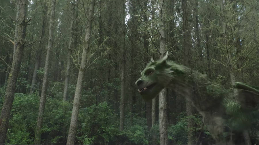 Pete's Dragon Walking In Woods Wallpaper