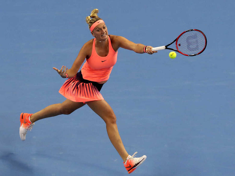 Petra Kvitova Jumping And Hitting Ball Wallpaper